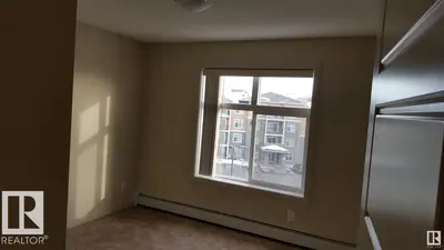 Photo 2 of #437 6076 SCHONSEE WY NW